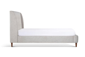 Upholstered Bed in gray color with buttoned headboard side view